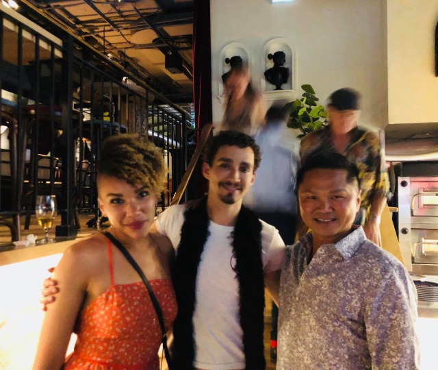 Our Master Instructor posing with a professional stunt crew and action movie actors during a martial arts industry event.